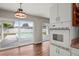 Kitchen area with view of the pool through sliding glass doors at 1848 68Th N Ave, St Petersburg, FL 33702