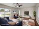 The staged living room features stylish seating and views to the pool at 1848 68Th N Ave, St Petersburg, FL 33702