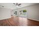 Open-concept living room with sleek wood flooring and pool views at 1848 68Th N Ave, St Petersburg, FL 33702