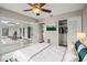 Staged bedroom with slider to backyard, closet, and ceiling fan at 1848 68Th N Ave, St Petersburg, FL 33702