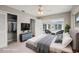 Staged main bedroom featuring closet, outdoor access, and contemporary furnishings at 1848 68Th N Ave, St Petersburg, FL 33702