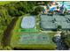 Aerial view of community sport courts including basketball and tennis, with some green space at 19309 Seacove Dr, Lutz, FL 33558