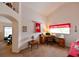 Bedroom with vaulted ceiling, home office set-up, and fan-shaped transom window above door at 19309 Seacove Dr, Lutz, FL 33558