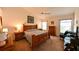 Cozy bedroom features vaulted ceiling, ceiling fan, carpet floors and traditional furnishings at 19309 Seacove Dr, Lutz, FL 33558