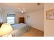 Bedroom with a bed, ceiling fan, window, and closet space at 19309 Seacove Dr, Lutz, FL 33558