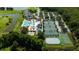 Aerial view of community amenities showing a swimming pool, tennis courts, basketball courts, and playground at 19309 Seacove Dr, Lutz, FL 33558
