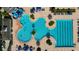 Aerial view of the resort-style community pool with multiple pools and a splash pad, perfect for Gathering fun and relaxation at 19309 Seacove Dr, Lutz, FL 33558