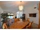 Well-lit dining room featuring chandelier lighting, large table, and neutral wall color at 19309 Seacove Dr, Lutz, FL 33558