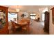 Elegant dining room featuring chandelier lighting, dining table, and a display cabinet at 19309 Seacove Dr, Lutz, FL 33558