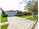 Charming single-Gathering home with a spacious driveway, green lawn, and well-kept landscaping at 19309 Seacove Dr, Lutz, FL 33558