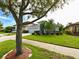 Desirable home with an attached two-car garage, lush lawn, and well-maintained landscaping at 19309 Seacove Dr, Lutz, FL 33558