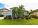 Charming single-Gathering home with a well-manicured lawn and mature landscaping and a two car garage at 19309 Seacove Dr, Lutz, FL 33558