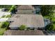 Aerial roof shot of house featuring an enclosed pool, manicured lawn, and backyard privacy at 19309 Seacove Dr, Lutz, FL 33558
