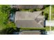 Aerial roof shot of home with screened-in pool and manicured lawn at 19309 Seacove Dr, Lutz, FL 33558