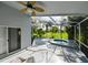 Inviting screened lanai with spa, ceiling fan, and golf course views, ideal for relaxing and enjoying the outdoors at 19309 Seacove Dr, Lutz, FL 33558