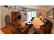 Living area with hardwood floors, comfortable leather furniture, decor shelves and glass doors to the yard at 19309 Seacove Dr, Lutz, FL 33558