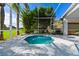 Private spa with screened lanai, lush greenery, and serene views, offering a tranquil retreat within your own backyard at 19309 Seacove Dr, Lutz, FL 33558