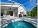 Relaxing pool area with screened lanai, seating, and grill, perfect for outdoor entertaining and enjoying the Florida lifestyle at 19309 Seacove Dr, Lutz, FL 33558