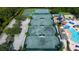 Aerial view of multiple tennis courts, basketball courts, playground, pool, and other community amenities at 19309 Seacove Dr, Lutz, FL 33558