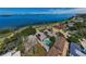 Stunning aerial view showcases waterfront homes with pools and solar panels, highlighting a prime location at 1951 Edgewater Dr, Clearwater, FL 33755