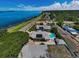 This waterfront home features a pool, separate guest house, and easy access to the water at 1951 Edgewater Dr, Clearwater, FL 33755