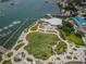 Breathtaking aerial view of the community park showcasing the outdoor amphitheater, green spaces, and waterfront at 1951 Edgewater Dr, Clearwater, FL 33755