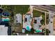 Aerial view showcasing residential homes with private pools, lush landscaping, and convenient street access at 1951 Edgewater Dr, Clearwater, FL 33755