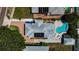 Aerial view of a private pool and solar panels, perfect for luxurious outdoor living and energy efficiency at 1951 Edgewater Dr, Clearwater, FL 33755