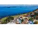 Overhead view of waterfront property boasting a pool, solar panels, and incredible views from an exceptional location at 1951 Edgewater Dr, Clearwater, FL 33755