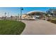 Outdoor amphitheater with lush green grass and concrete walkways, perfect for community events at 1951 Edgewater Dr, Clearwater, FL 33755