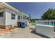 Backyard featuring a pool, patio, and well-maintained landscaping, creating a private outdoor oasis at 1951 Edgewater Dr, Clearwater, FL 33755