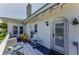 Cozy balcony featuring comfortable seating, plants, and string lights for a relaxing outdoor experience at 1951 Edgewater Dr, Clearwater, FL 33755