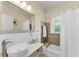 Bathroom showcasing a vanity sink with a vessel sink, a bathtub and shower combination at 1951 Edgewater Dr, Clearwater, FL 33755