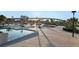 Beautiful community park featuring a water feature, ample seating, walkways, landscaping and an overpass in the background at 1951 Edgewater Dr, Clearwater, FL 33755