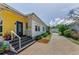 Inviting home entrance featuring a brick driveway, landscaped yard, and a charming exterior at 1951 Edgewater Dr, Clearwater, FL 33755