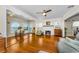 Open-concept living room featuring hardwood floors, fireplace, and a stunning water view at 1951 Edgewater Dr, Clearwater, FL 33755