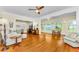 Bright living room boasting an open floor plan, hardwood floors and water views at 1951 Edgewater Dr, Clearwater, FL 33755