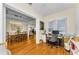 Bright office adjacent to dining room featuring hardwood floors, computer desk, and natural light at 1951 Edgewater Dr, Clearwater, FL 33755