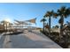 Scenic park view with modern shade structures and lush landscaping at 1951 Edgewater Dr, Clearwater, FL 33755