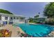 A gorgeous kidney-shaped pool and deck provide the perfect backyard oasis to entertain or relax at 1951 Edgewater Dr, Clearwater, FL 33755