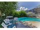 Peaceful pool area with comfortable seating, ideal for relaxation amidst the beautiful surroundings at 1951 Edgewater Dr, Clearwater, FL 33755
