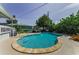 A gorgeous kidney-shaped pool and deck provide the perfect backyard oasis to entertain or relax at 1951 Edgewater Dr, Clearwater, FL 33755