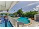 Refreshing outdoor pool with a spacious deck area, perfect for relaxation and entertaining guests at 1951 Edgewater Dr, Clearwater, FL 33755