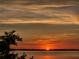 Breathtaking sunset view with vibrant colors painting the sky over a serene body of water at 1951 Edgewater Dr, Clearwater, FL 33755