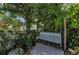 Relaxing swing nestled among lush greenery, offering a tranquil spot for quiet contemplation at 1951 Edgewater Dr, Clearwater, FL 33755