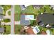 Aerial shot highlighting the property's layout, including the pool, private dock, and surrounding waterfront at 1964 Tanglewood Ne Dr, St Petersburg, FL 33702