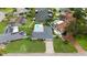 Stunning waterfront home featuring a private pool, boat dock, and lush landscaping at 1964 Tanglewood Ne Dr, St Petersburg, FL 33702