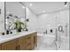 Modern bathroom with double vanity, a soaking tub, and a glass-enclosed shower at 1964 Tanglewood Ne Dr, St Petersburg, FL 33702