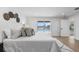 Main bedroom with a pool view through sliding glass doors and modern decorations at 1964 Tanglewood Ne Dr, St Petersburg, FL 33702