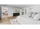 Bright main bedroom featuring a walk-in closet, dresser, and modern décor at 1964 Tanglewood Ne Dr, St Petersburg, FL 33702